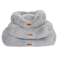 AllPetSolutions grey plush dog bed with a dog settled inside