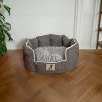 AllPetSolutions Alfie brown dog bed with a dog settled inside
