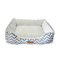 AllPetSolutions Daisy grey zigzag dog bed with a dog settled inside