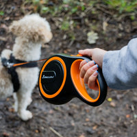 AllPetSolutions orange retractable lead with the tape fully extended