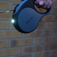 AllPetSolutions retractable grey dog lead with the LED light switched on