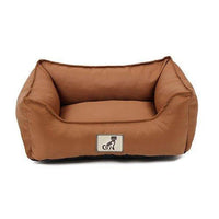 AllPetSolutions Dexter brown waterproof dog bed shown in a home setting