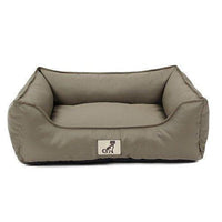 AllPetSolutions Dexter green waterproof dog bed with a dog lying on it