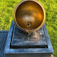 AllPetSolutions golden globe feature with water running over the globe