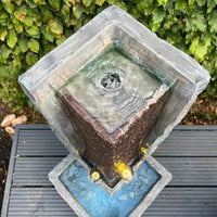 AllPetSolutions modern column water feature sited on a garden patio